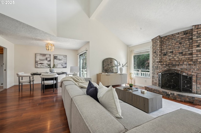 950 NW 161st Ter, Beaverton, OR 97006 - living room featuring wood-type flooring, a brick fireplace, and a textured ceiling