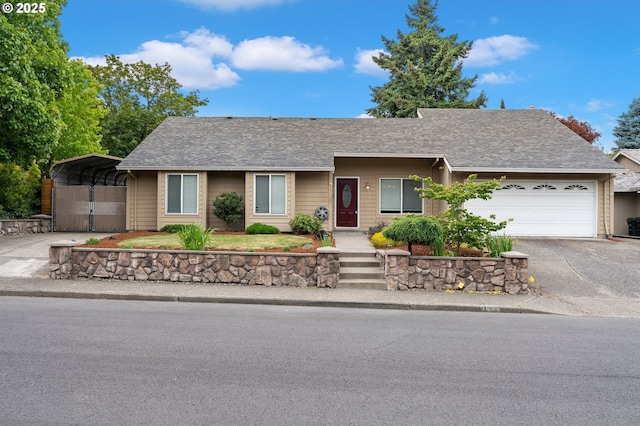 4935 NW Kahneeta Ct, Portland, OR 97229 - single story home with asphalt driveway, a detached carport, a garage, and a shingled roof
