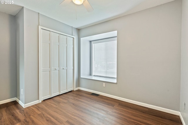 4935 NW Kahneeta Ct, Portland, OR 97229 - unfurnished bedroom featuring dark wood-style flooring, a closet, and ceiling fan