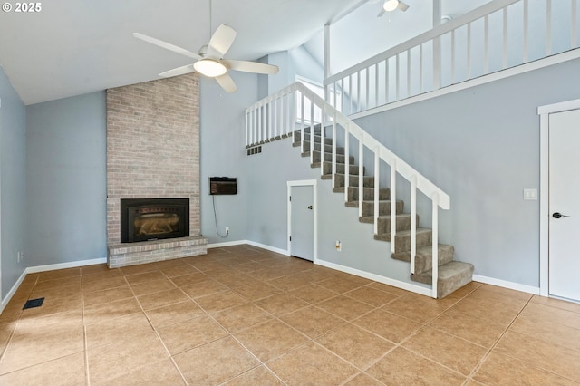 4935 NW Kahneeta Ct, Portland, OR 97229 - unfurnished living room with high vaulted ceiling, tile patterned flooring, a ceiling fan, stairway, and a brick fireplace