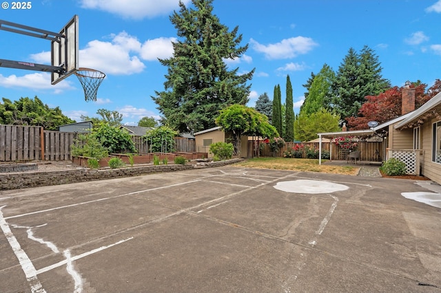 4935 NW Kahneeta Ct, Portland, OR 97229 - view of basketball court featuring basketball court and a fenced backyard