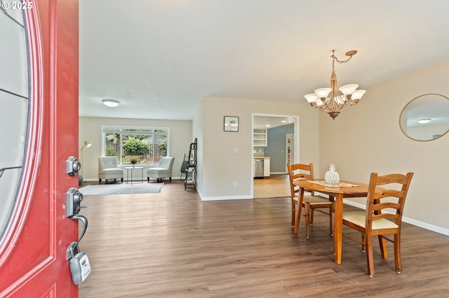 4935 NW Kahneeta Ct, Portland, OR 97229 - dining space featuring a chandelier and wood finished floors