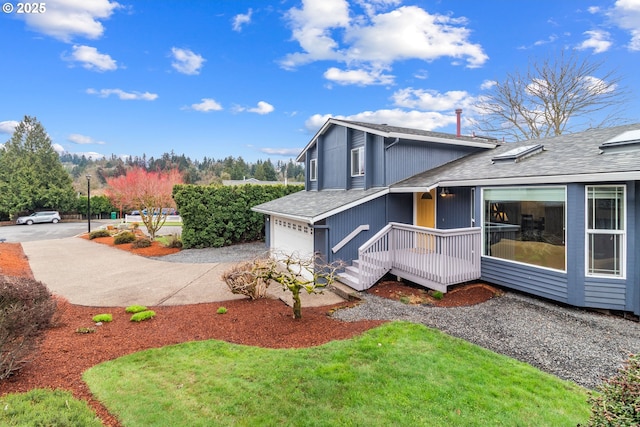 view of property exterior featuring driveway and roof with shingles