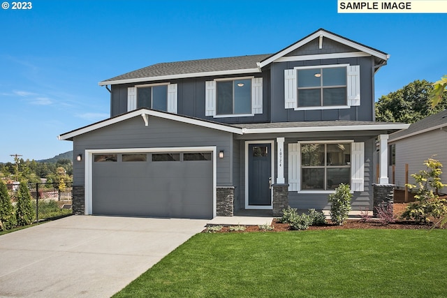 view of front of home featuring concrete driveway, stone siding, fence, board and batten siding, and a front yard