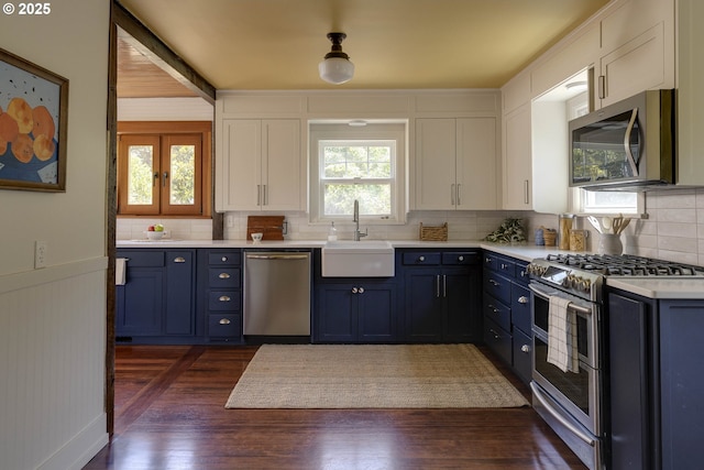 1040 S Park St, Carlton, OR 97111 - kitchen featuring appliances with stainless steel finishes, tasteful backsplash, white cabinetry, and light countertops