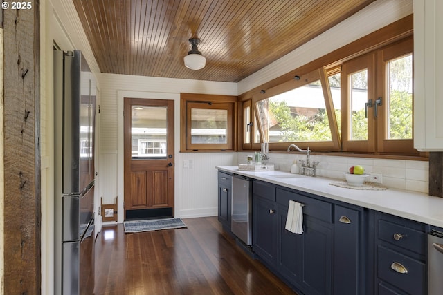 1040 S Park St, Carlton, OR 97111 - kitchen featuring stainless steel appliances, blue cabinets, dark wood-style flooring, light countertops, and wooden ceiling