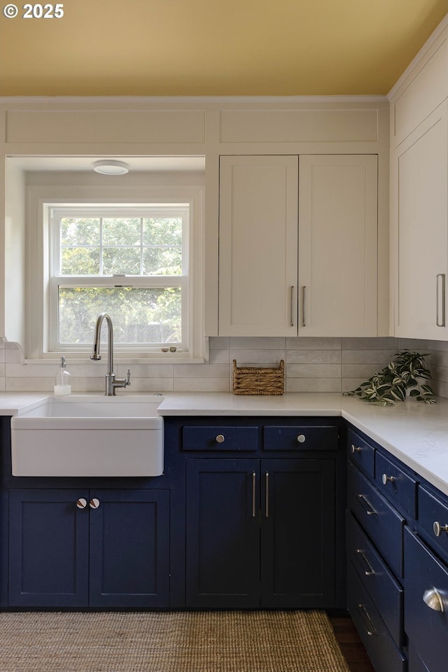 1040 S Park St, Carlton, OR 97111 - kitchen featuring blue cabinetry, tasteful backsplash, white cabinetry, and light countertops