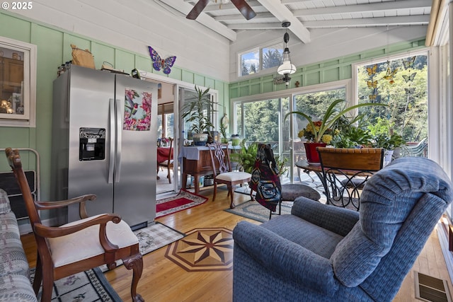 3419 S Ballard Ln, Lincoln City, OR 97367 - sunroom / solarium with a ceiling fan, wood finished floors, and wood walls