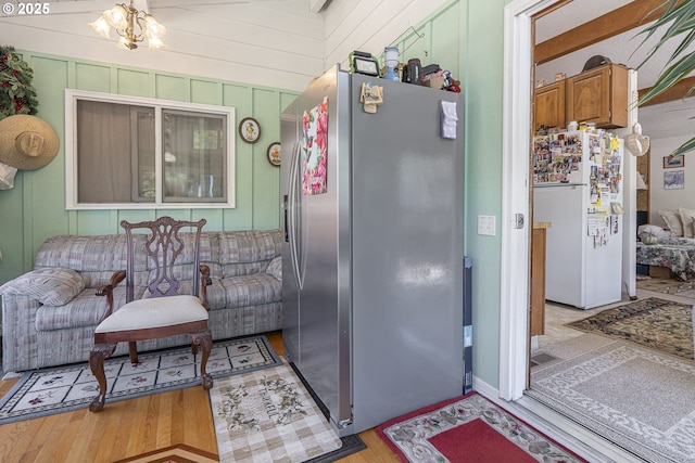 3419 S Ballard Ln, Lincoln City, OR 97367 - kitchen with stainless steel fridge, freestanding refrigerator, and light wood finished floors