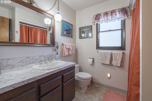 3419 S Ballard Ln, Lincoln City, OR 97367 - bathroom featuring toilet, vanity, baseboards, and tile patterned floors