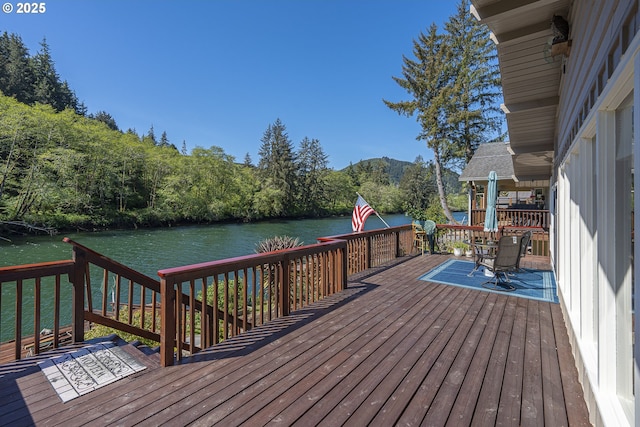 3419 S Ballard Ln, Lincoln City, OR 97367 - wooden terrace featuring a water and mountain view and outdoor dining area