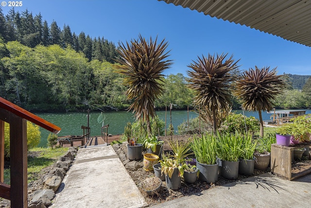 3419 S Ballard Ln, Lincoln City, OR 97367 - view of patio / terrace featuring a water view and a dock