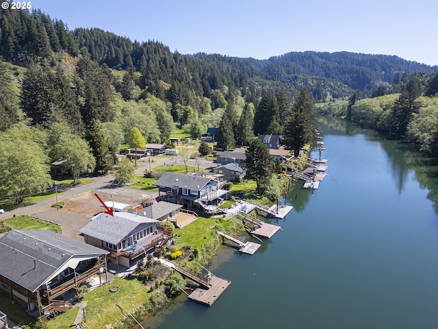 3419 S Ballard Ln, Lincoln City, OR 97367 - aerial view of a forest and a large body of water