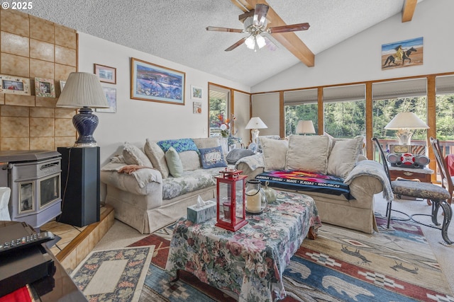3419 S Ballard Ln, Lincoln City, OR 97367 - carpeted living room with a wood stove, a ceiling fan, and a textured ceiling