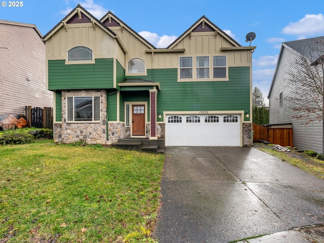 view of front facade featuring a garage and a front lawn