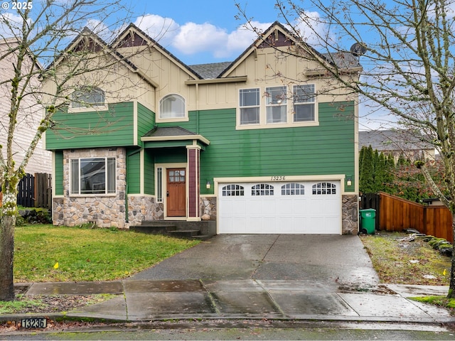 view of front of home featuring a garage and a front lawn