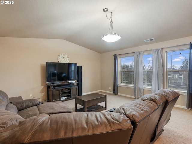 living room with light carpet and vaulted ceiling