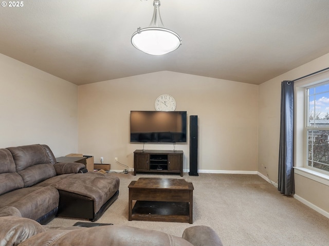 living room featuring light carpet and vaulted ceiling