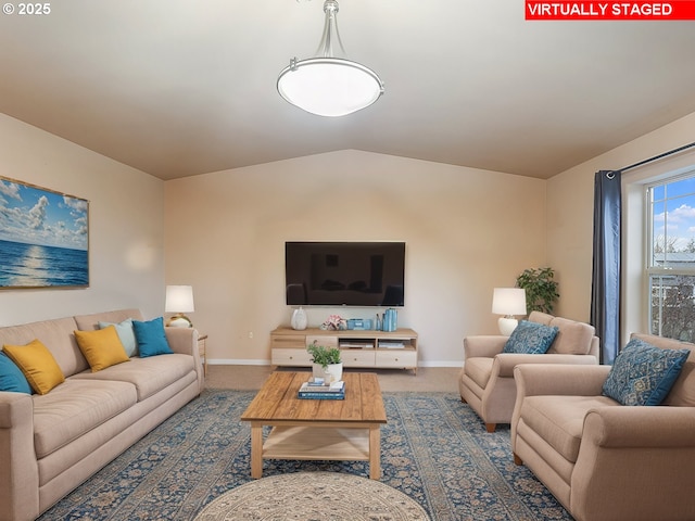 living room with carpet flooring and vaulted ceiling