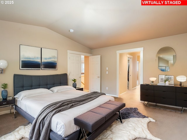 bedroom with light carpet and lofted ceiling