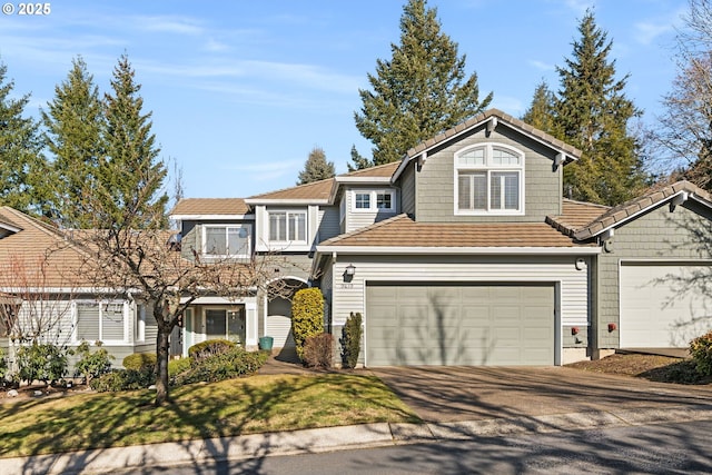 9619 NW Silver Ridge Loop, Portland, OR 97229 - view of front facade featuring asphalt driveway, an attached garage, and a front lawn