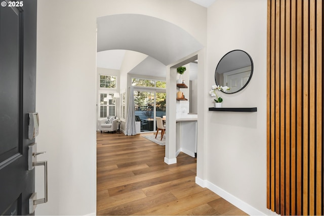 9619 NW Silver Ridge Loop, Portland, OR 97229 - foyer entrance featuring arched walkways, wood finished floors, and baseboards
