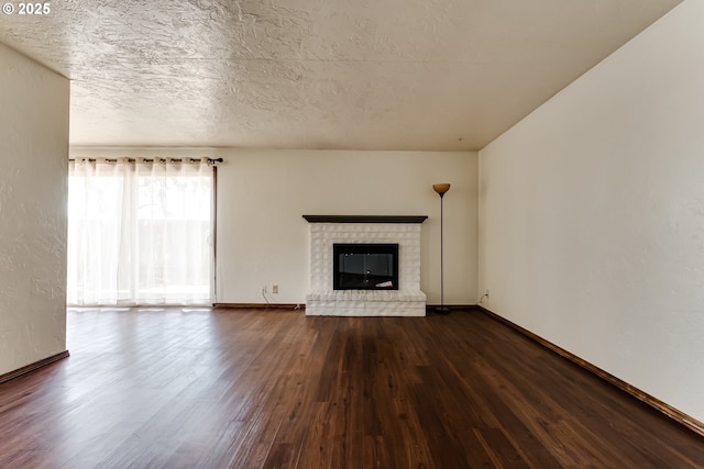 786788 W Quinalt St, Springfield, OR 97477 - unfurnished living room with dark wood-type flooring and a brick fireplace