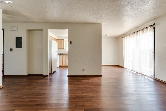 786788 W Quinalt St, Springfield, OR 97477 - unfurnished room featuring electric panel, dark wood-style floors, and a textured ceiling