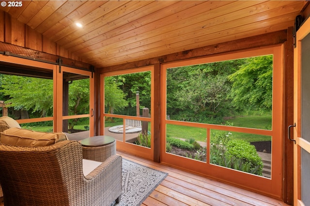 sunroom / solarium with vaulted ceiling and healthy amount of natural light