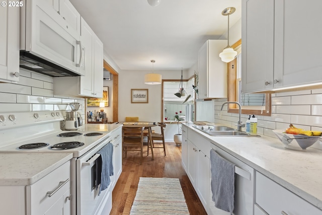 2325 Laurel Ave, Salem, OR 97301 - kitchen with white appliances, a sink, white cabinets, dark wood-style floors, and tasteful backsplash