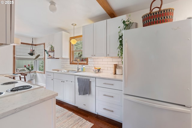 2325 Laurel Ave, Salem, OR 97301 - kitchen featuring freestanding refrigerator, decorative backsplash, white cabinets, a sink, and beam ceiling