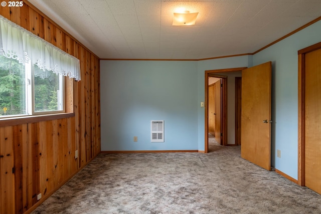 3333 Bullock Rd, Oakland, OR 97462 - unfurnished room with carpet, heating unit, crown molding, and wood walls