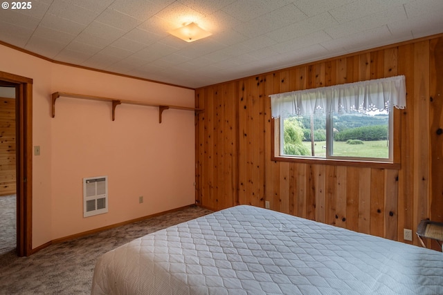 3333 Bullock Rd, Oakland, OR 97462 - carpeted bedroom featuring heating unit, wooden walls, and ornamental molding