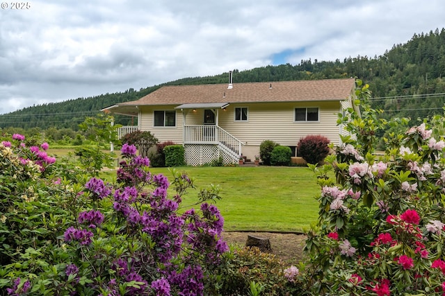 3333 Bullock Rd, Oakland, OR 97462 - rear view of property featuring a view of trees and a lawn