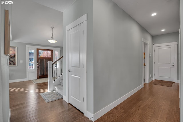 hall with hardwood / wood-style floors