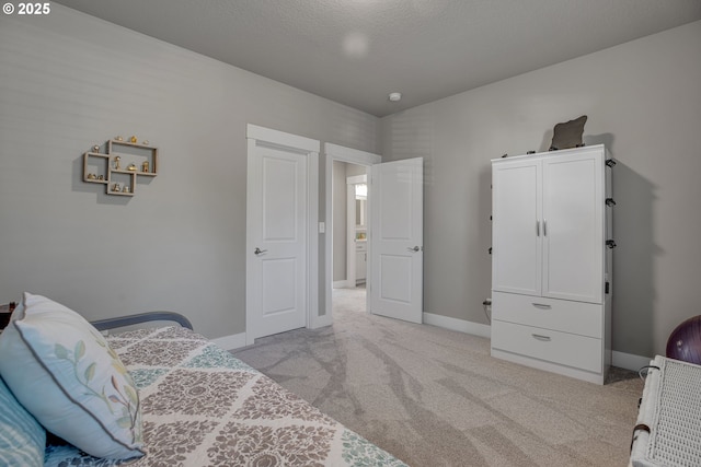 carpeted bedroom featuring a textured ceiling