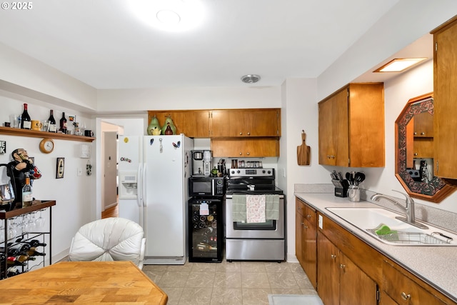 17222 SW Blanton St, Beaverton, OR 97078 - kitchen with electric range, white fridge with ice dispenser, beverage cooler, and brown cabinets