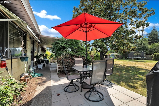 17222 SW Blanton St, Beaverton, OR 97078 - fenced backyard featuring a trampoline, a patio area, and outdoor dining space