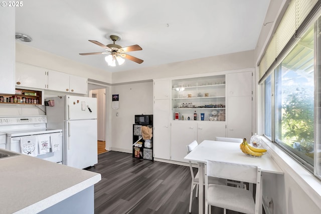 17222 SW Blanton St, Beaverton, OR 97078 - kitchen with white appliances, healthy amount of natural light, a ceiling fan, and dark wood-style floors