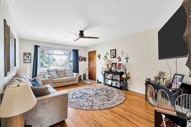 17222 SW Blanton St, Beaverton, OR 97078 - living area featuring ceiling fan, wood finished floors, and a textured ceiling