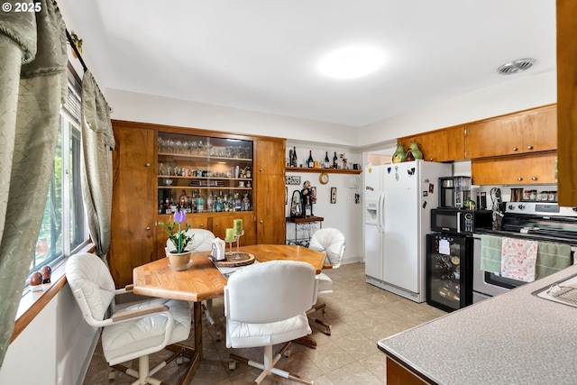 17222 SW Blanton St, Beaverton, OR 97078 - dining space featuring wine cooler and light flooring