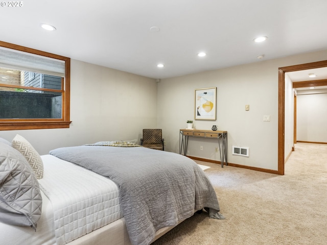 bedroom featuring baseboards, recessed lighting, visible vents, and light colored carpet