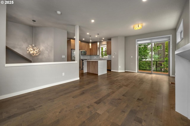 5942 NE 42nd Ave, Portland, OR 97218 - unfurnished living room with dark wood-style floors, a chandelier, and recessed lighting