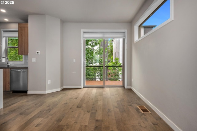5942 NE 42nd Ave, Portland, OR 97218 - unfurnished living room with dark wood-style flooring and recessed lighting
