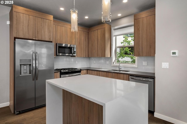 5942 NE 42nd Ave, Portland, OR 97218 - kitchen featuring stainless steel appliances, backsplash, dark wood finished floors, recessed lighting, and a kitchen island