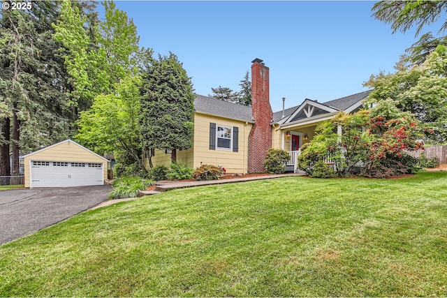 3900 SW Dolph Ct, Portland, OR 97219 - view of front facade featuring a garage, an outdoor structure, and a chimney