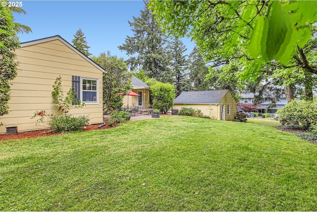 3900 SW Dolph Ct, Portland, OR 97219 - view of green lawn with a patio