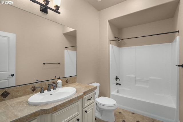 full bathroom with vanity, bathing tub / shower combination, and toilet