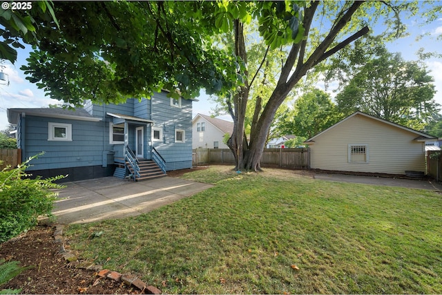 1225 N Emerson St, Portland, OR 97217 - fenced backyard with a patio and entry steps