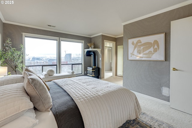 bedroom with visible vents, baseboards, a city view, ornamental molding, and carpet floors